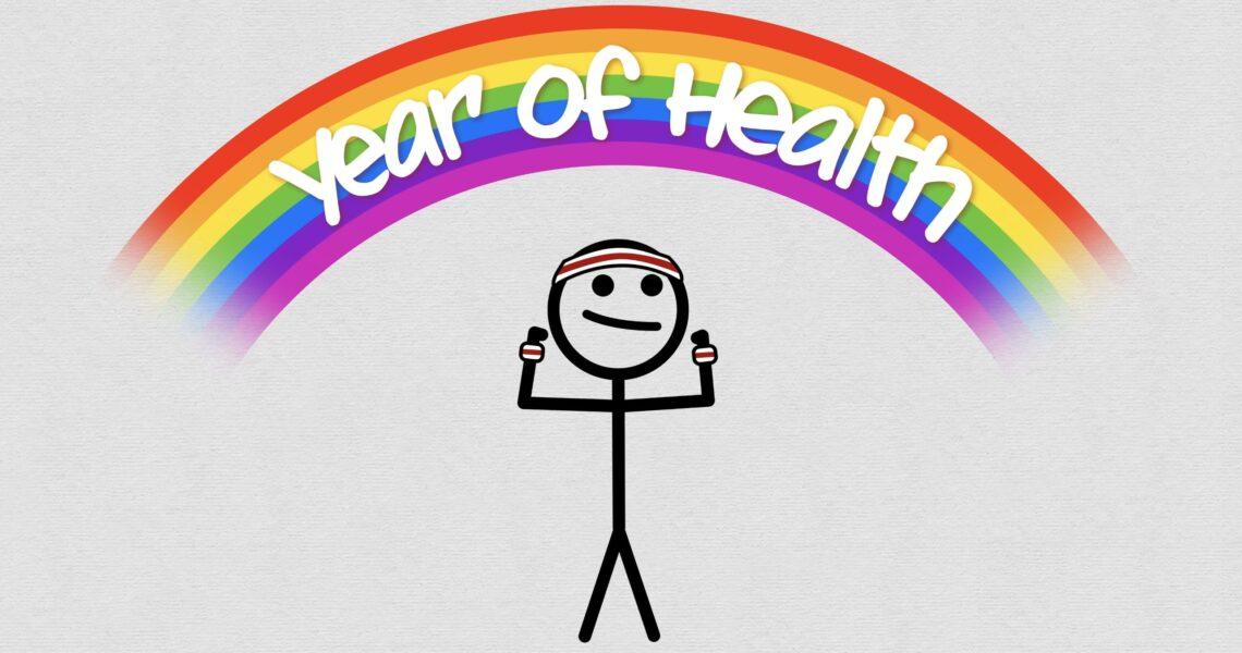 Eine Strichmännchen steht vor einem Regenbogen mit der Aufschrift „Jahr der Gesundheit“.